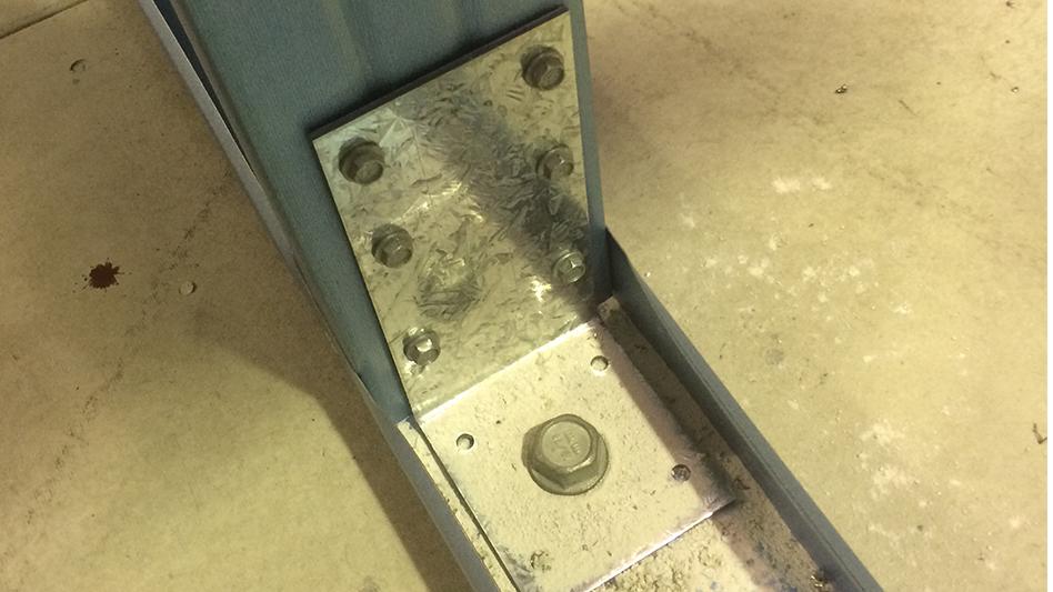 Masonry anchors attaching to both stud and bottom plate where the stud acts as a tie-down rod for truss connections