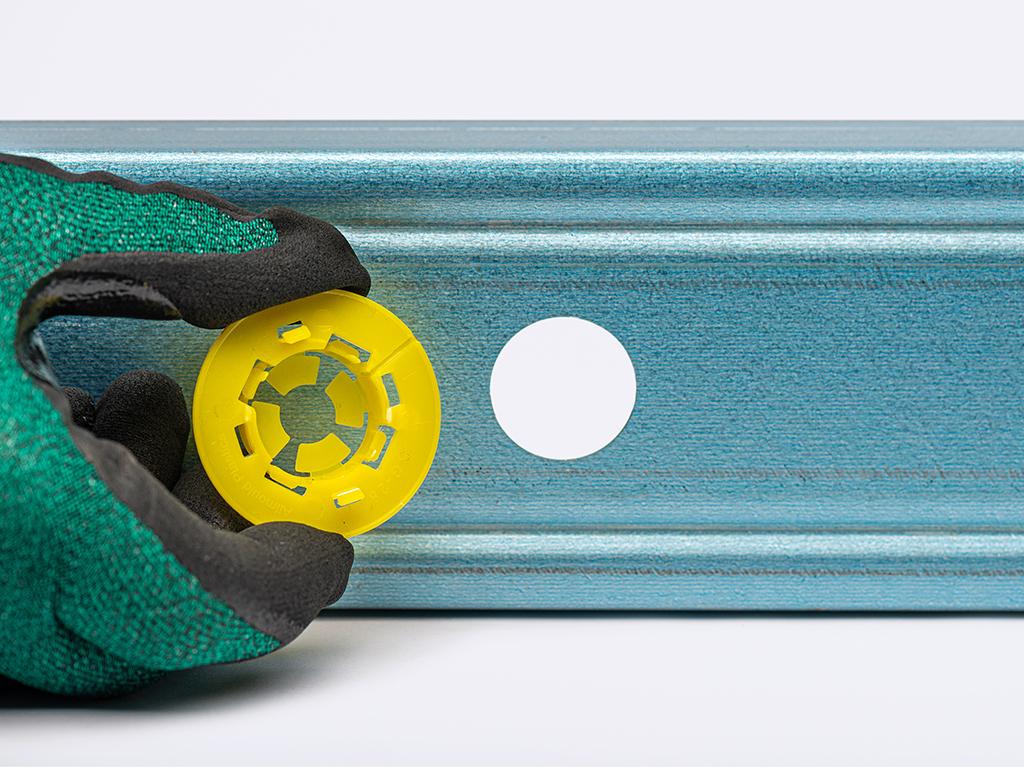 Prepunched service hole in LGS with grommet